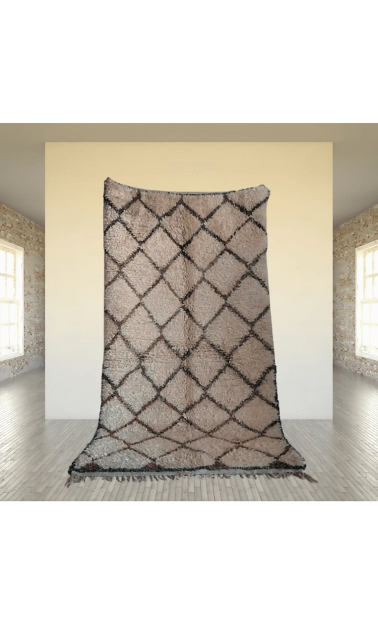 Soft neutral Beni Ourain runner featuring diamond patterns, showcasing Moroccan craftsmanship in a bright room setting.